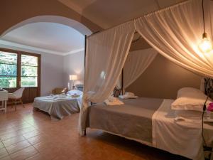 Postel nebo postele na pokoji v ubytování Locanda dei Sette Limoni - camere e residence