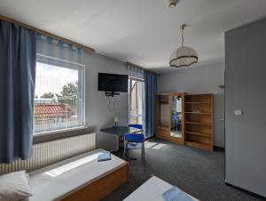 Łóżko lub łóżka w pokoju w obiekcie Motel DRABEK