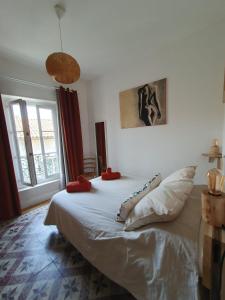 Posteľ alebo postele v izbe v ubytovaní CasaBell Appartement atypique vintage