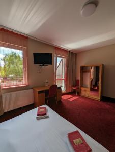 Łóżko lub łóżka w pokoju w obiekcie Motel DRABEK