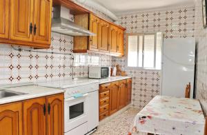Kuchyňa alebo kuchynka v ubytovaní Apartamento Red Rouse