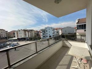 a balcony with a view of a city with buildings at 140 m2 Size Ait in Çayirhisar