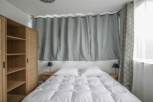 Posteľ alebo postele v izbe v ubytovaní Appartement au cœur d'Etretat avec parking gratuit