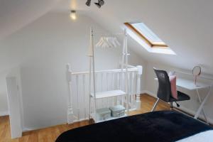 a bedroom with a bed and a desk and a chair at Remarkable 3-Bed House in Bath in Bath