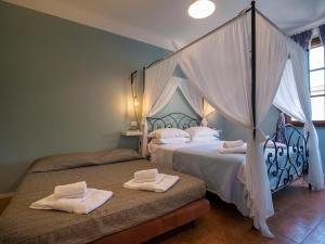 Postel nebo postele na pokoji v ubytování Locanda dei Sette Limoni - camere e residence