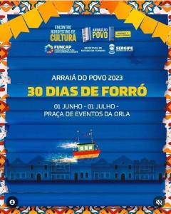 a poster for a concert with a boat on the water at Pousada Casa da Vovó - Sua casa pertinho da Praia in Aracaju