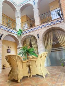 a room with a table and chairs in a building at Casa Rural La Higuera I Puy du Fou in Pulgar