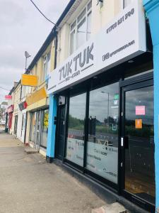 a row of store fronts on a street at AC Hideout in Rochford