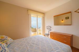 En eller flere senge i et værelse på Rincón De María Cerca Playa Vistas Mar Terraza Barbacoa