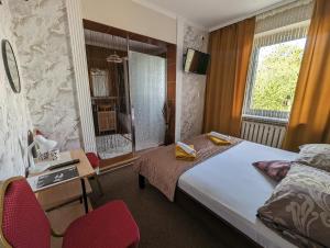 Łóżko lub łóżka w pokoju w obiekcie Motel DRABEK