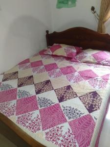 En eller flere senge i et værelse på Asiri Resort - Home Stay For Foreign Tourists