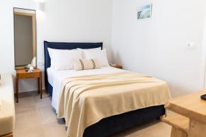 Posteľ alebo postele v izbe v ubytovaní Asimina Hotel