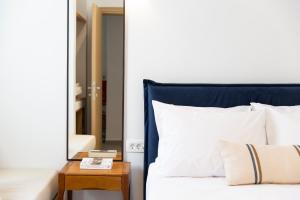 Posteľ alebo postele v izbe v ubytovaní Asimina Hotel