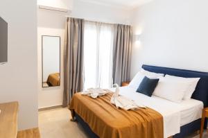 Posteľ alebo postele v izbe v ubytovaní Asimina Hotel