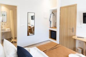 Posteľ alebo postele v izbe v ubytovaní Asimina Hotel