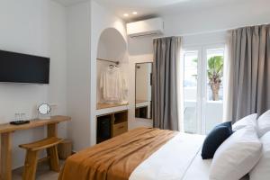 Posteľ alebo postele v izbe v ubytovaní Asimina Hotel