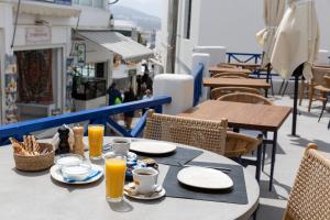 Reštaurácia alebo iné gastronomické zariadenie v ubytovaní Asimina Hotel
