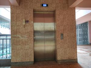 a elevator in a building with its door open at Modern & Comfy Mt. Kenya Sunset View Apartment in Kangaru