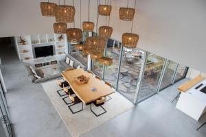 an overhead view of a dining room with a table and chairs at Casa da Rocha by White Exclusive Suites & Villas in Lagoa