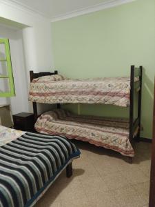 a room with two bunk beds in a room at Hostel El Rejunte in Mar del Plata