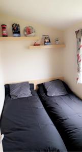 two beds sitting next to each other in a room at Whitley bay caravan retreat in Whitley Bay