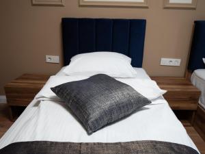 Voodi või voodid majutusasutuse Amber Hotel toas