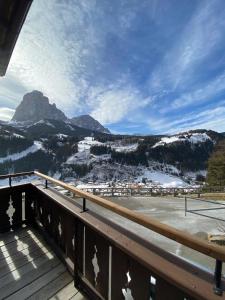 a balcony with a view of a snowy mountain at Pension Dolomieu in Santa Cristina Gherdëina