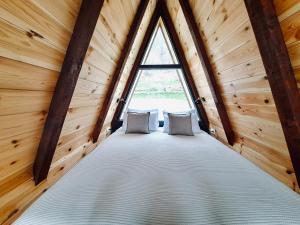 Postelja oz. postelje v sobi nastanitve Fern Farm Tiny Home