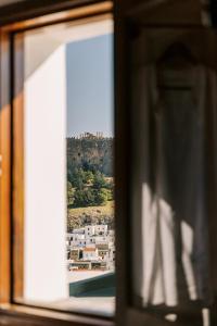 a view of a castle from a window at ARTE LINDOS SUITES in Lindos