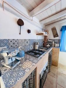 Kuchyň nebo kuchyňský kout v ubytování I Trulli di Giorgia