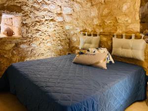Postel nebo postele na pokoji v ubytování I Trulli di Giorgia