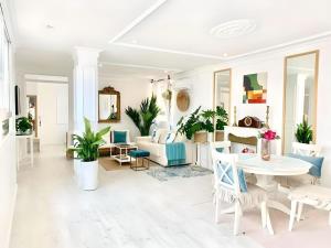 a living room with a table and chairs at Lux City Loft in front of the Port in Alicante