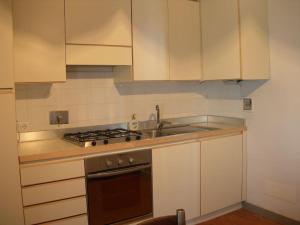 A kitchen or kitchenette at La Tuia Vacanze apt for 4PP and apt for 2PP