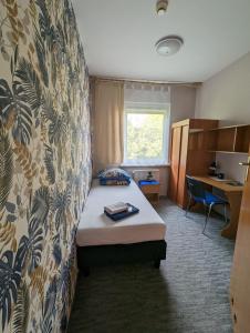 Łóżko lub łóżka w pokoju w obiekcie Motel DRABEK
