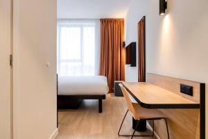 Postel nebo postele na pokoji v ubytování B&B HOTEL Mechelen