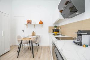 Kuchyňa alebo kuchynka v ubytovaní ®Le Cosy - Studio de charme + 6 fotografií