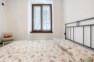 Katil atau katil-katil dalam bilik di Appartamento nel cuore di Tenno