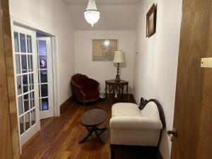 a living room with a couch and a chair at Oakview Bed and Breakfast in New Orleans