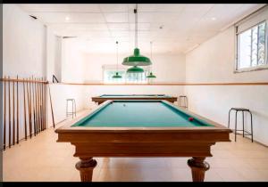 a pool table in the middle of a room at Masia Can Rovira - ESC1852 in San Lorenzo de Hortóns