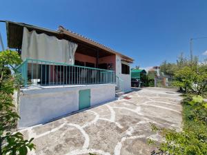 a house with a walkway in front of it at Dream in Chalkidiki 2 bedroom villa with garden in Néa Tríglia