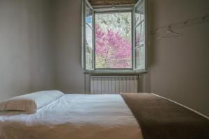 Postel nebo postele na pokoji v ubytování Albergo La Pietra