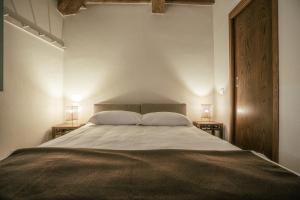 Postel nebo postele na pokoji v ubytování Albergo La Pietra