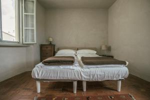 Postel nebo postele na pokoji v ubytování Albergo La Pietra