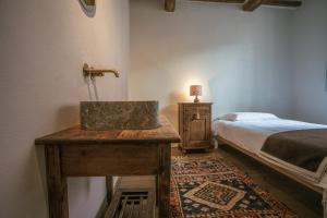 Postel nebo postele na pokoji v ubytování Albergo La Pietra