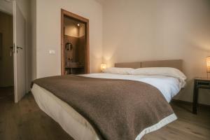 Postel nebo postele na pokoji v ubytování Albergo La Pietra