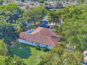 an overhead view of a house with a red roof at Coral Spring's Florida Paradise House. in Coral Springs