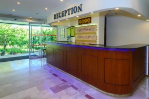 a reception area of a restaurant with a counter at Grand Hotel Derin-All Inclusive in Beldibi +71 photos