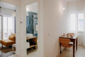 a room with a table and a chair and a mirror at PETRARCA17 Guest house a due passi dal mare in Terracina