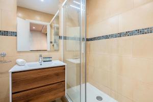 a bathroom with a sink and a shower at Barcelona Eixample in Barcelona +37 photos