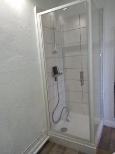 a shower with a phone in a bathroom at la petite maison d'Albert in La Motte-Saint-Jean